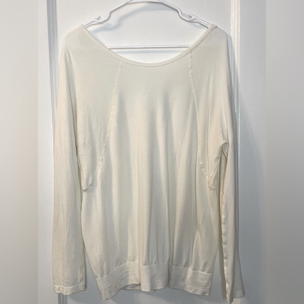Cream-colored long-sleeved Sweaty Betty shirt, perfect layer!